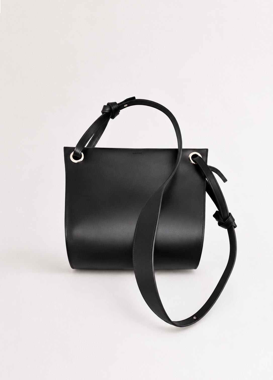 MALONE SLING — black Italian vegetable-tanned leather crossbody bag, front view