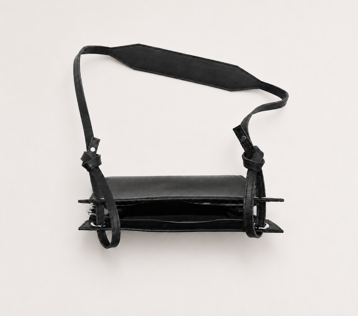 MALONE SLING — black leather crossbody bag, interior canvas pocket detail
